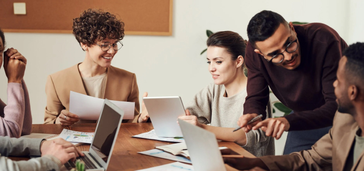 group of people sitting indoors 3184360