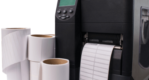 Thermal printer with blank barcode labels and barcode ribbons used for precise and durable label printing.