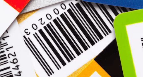 A collection of colorful cards with printed barcodes stacked together.